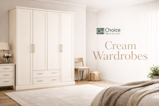 A bedroom with a cream-colored wardrobe, a matching nightstand with a lamp and plant, a wooden chair, a laundry basket, and a rug. Text reads “Choice Wardrobe Cream Wardrobes.”.