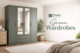 A green wardrobe with mirrored doors stands in a bright, modern bedroom. Nearby are a wooden dresser, a potted plant, and a bed. The text reads, Choice Wardrobe Green Wardrobes.
