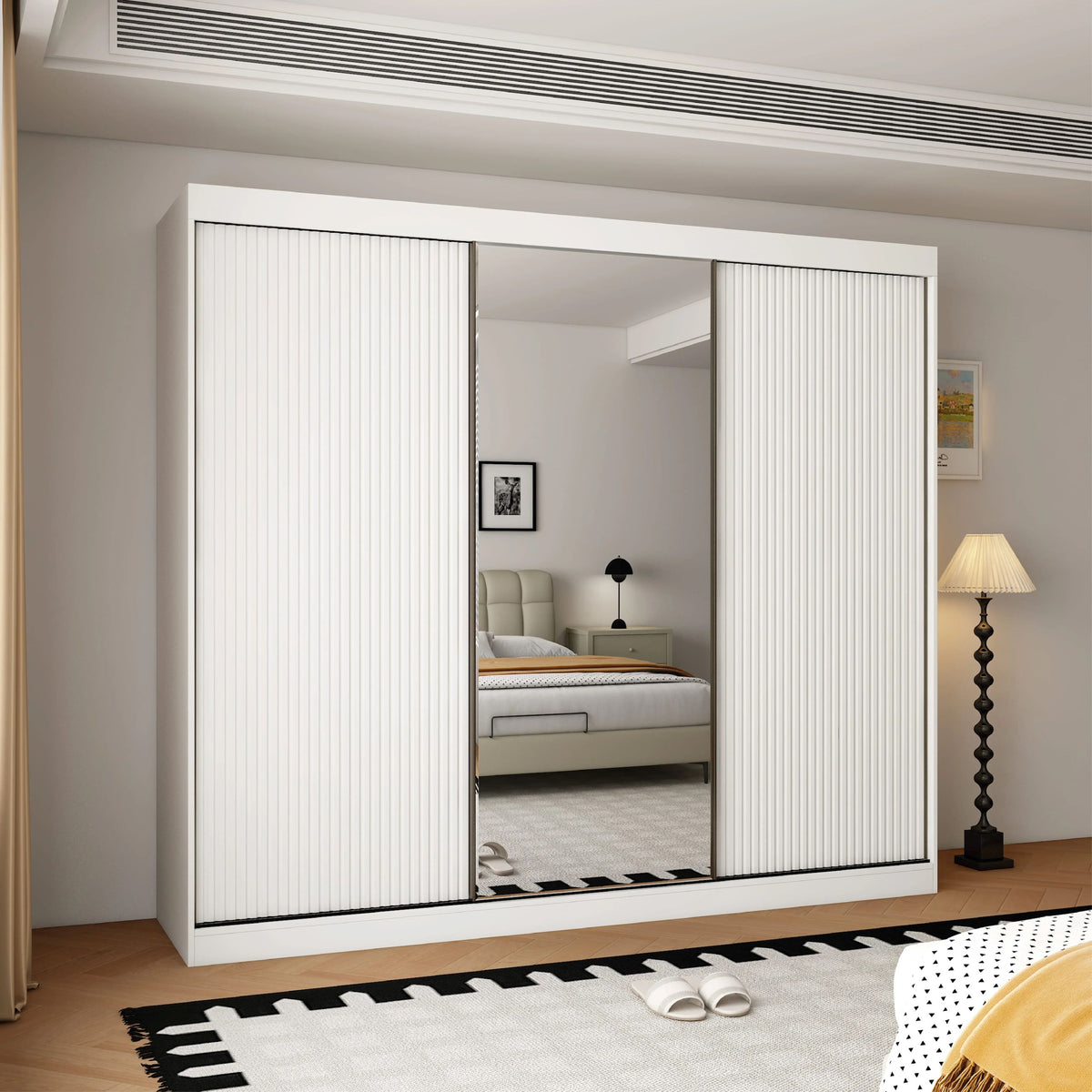 White 3-door sliding wardrobe with central mirrored door and fluted outer doors