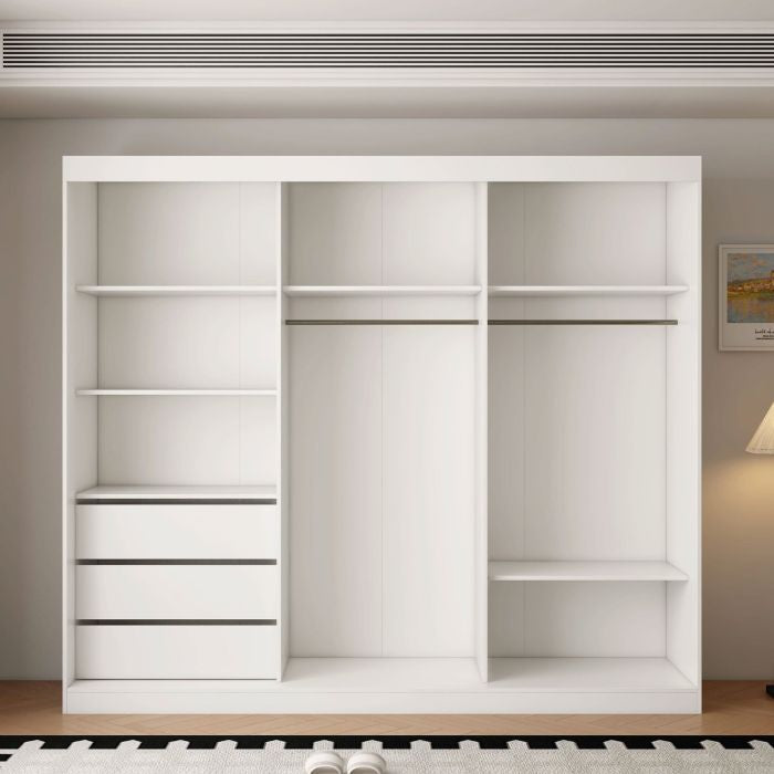White 3-door sliding wardrobe with shelves, drawers, and a mirrored door panel.