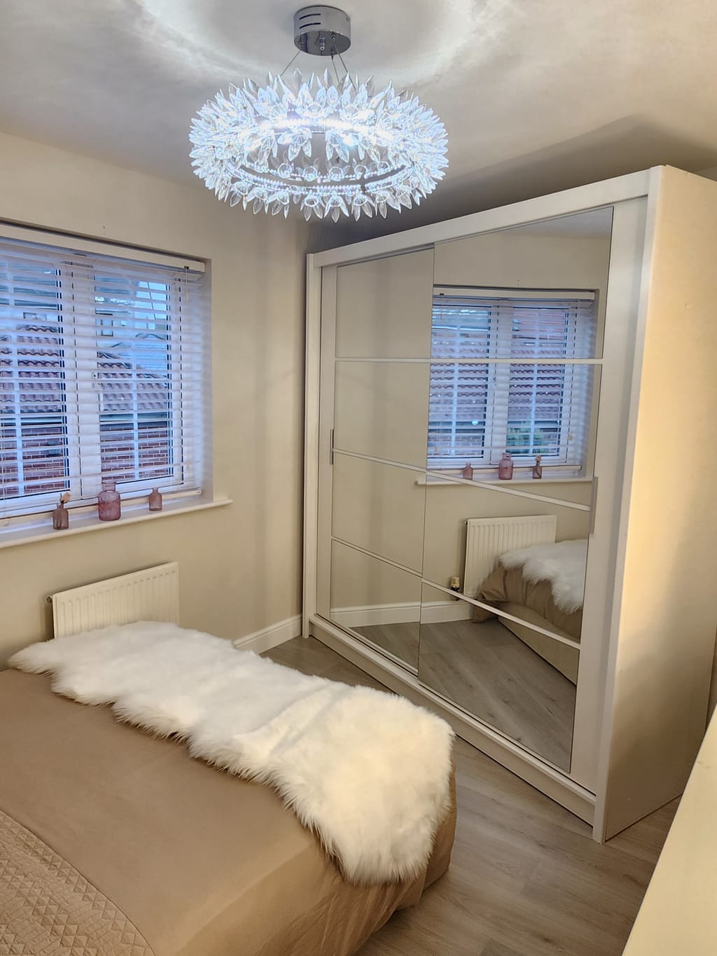 Dexter 160cm white mirrored sliding wardrobe installed beside a double bed