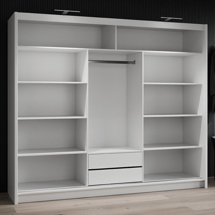 Open white 3-door sliding wardrobe with mirrored doors, showing shelves and two drawers