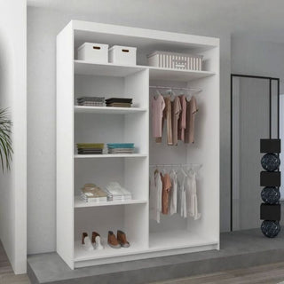 The BARTHOLOMEW 2 Door Mirrored Sliding Wardrobe in white (120cm) features shelves for folded clothes, shoes, and storage boxes, plus hanging rods for shirts and dresses. Perfect for modern, minimalistic rooms.