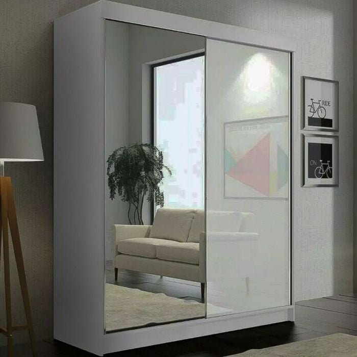 CHOICEWARDROBE Texas 120cm white 2-door mirrored sliding wardrobe reflects a sofa and plant.