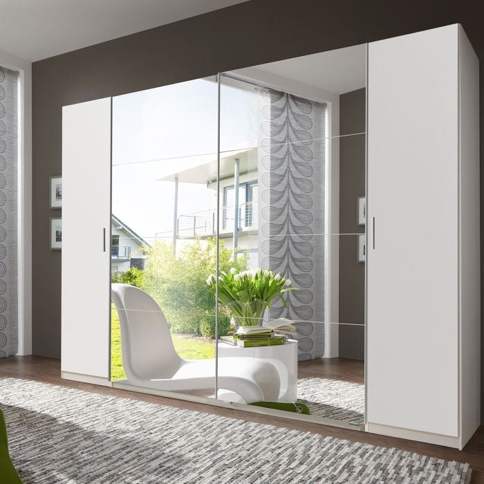 White 316cm sliding wardrobe with mirrored front doors reflecting room interior.