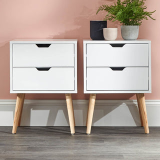 Pair of Norwich White Wooden Bedside Cabinets with wooden legs, each featuring two drawers