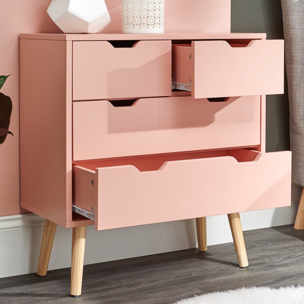 Coral pink chest of 4 drawers with light wood legs, two drawers open.