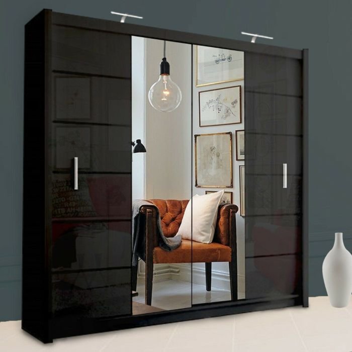 LISBANE 203cm black sliding wardrobe with mirrored doors reflecting an armchair and art.