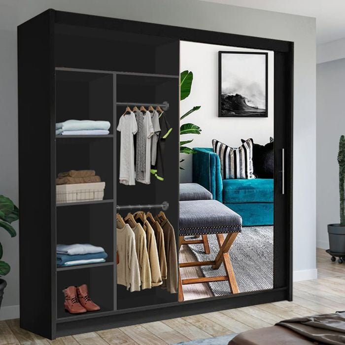 KEYNES 2 Door Mirrored Wardrobe in black, open to show shelves with clothes and shoes, reflecting a living room.