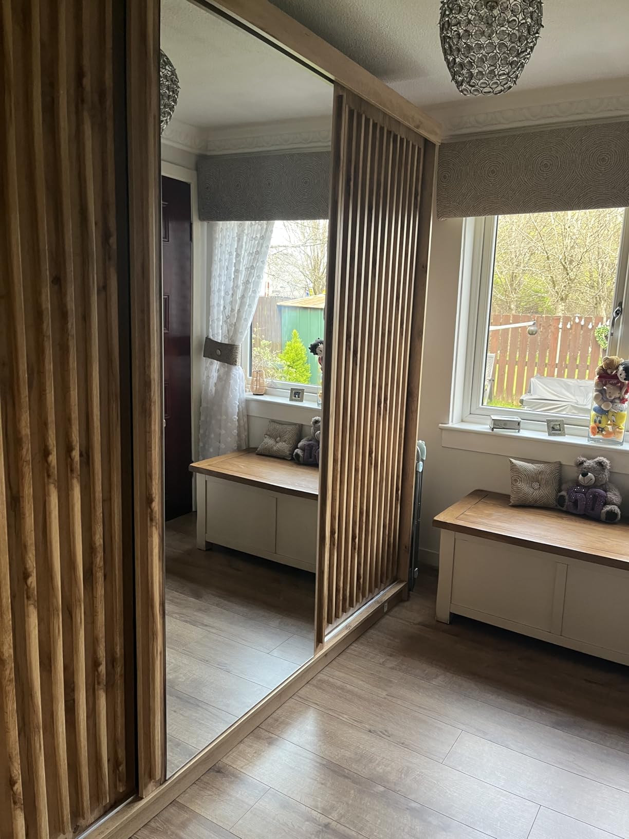 Zeus 250cm sliding door wardrobe in oak finish with mirrored centre door.