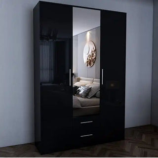 The WINSTEAD 3 Door Mirrored Wardrobe in sleek black (135cm) stands against a light wall, featuring a glossy center mirror that reflects the room and two spacious bottom drawers for essential storage.