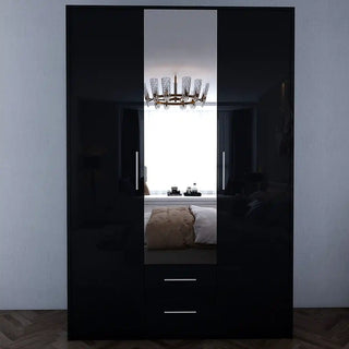 The WINSTEAD 3 Door Mirrored Wardrobe Black 135cm features a high gloss mirrored center that reflects a stylish bedroom. Its sleek design includes two bottom drawers for essential storage, making it perfect for modern, well-lit rooms.