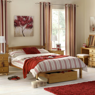 Julian Bowen Pickwick solid pine bed in a bedroom setting