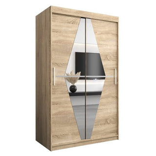 The CHOICEWARDROBE Beloit Mirrored Wardrobe features 2 sliding doors with vertical diamond-shaped mirrors, finished in Sonoma Oak. The mirrored fronts reflect a TV and vase, with the wardrobe set against a white background.