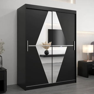 The CHOICEWARDROBE Beloit Mirrored Wardrobe with 2 sliding black mirror doors adds a modern touch to the room, reflecting a vase of dried flowers and perfectly complementing minimal decor and neutral tones.