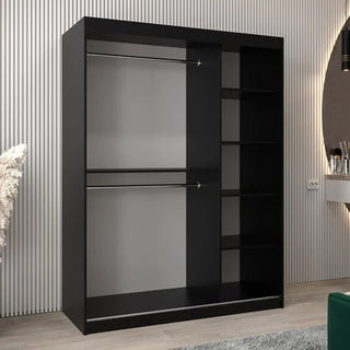 The Beloit Mirrored Wardrobe with 2 sliding doors (150cm, Black) features double hanging rods and five open shelves—ideal bedroom storage showcased against a light, vertically striped wall in a modern setting.