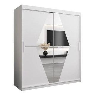 The Beloit Mirrored Wardrobe with 2 sliding doors (180cm, White) features a modern geometric design. Its mirrored finish reflects a TV, shelf, and decor, making it the perfect stylish addition to any minimalistic bedroom.