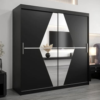 The Beloit Mirrored Wardrobe 2 Sliding Doors 200cm in Black features a striking white and gray geometric pattern, complementing light walls, a lamp, and a vase with dried plants in a modern bedroom.