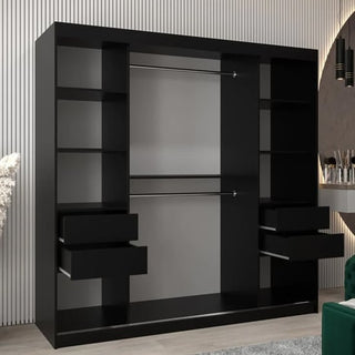 The Beloit Mirrored Wardrobe with 2 sliding doors (200cm) in black features multiple shelves, four drawers, and hanging rods, standing elegantly against a striped wall in a modern room with light wood flooring.