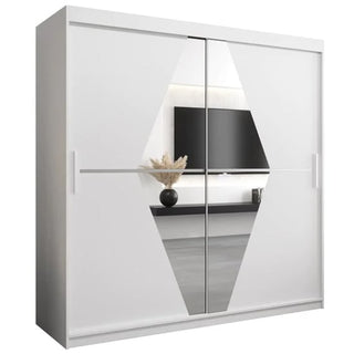 The Beloit Mirrored Wardrobe 2 Sliding Doors 200cm in White features a central geometric mirrored design that beautifully reflects décor like a black vase with pampas grass and a modern TV, adding chic style to any bedroom furniture ensemble.