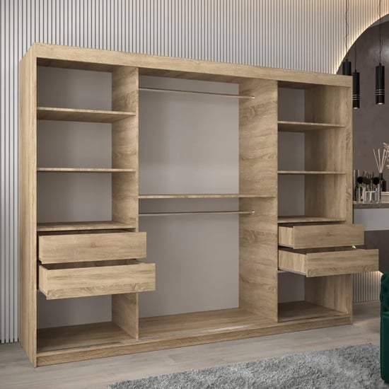 Sonoma Oak sliding door wardrobe interior view with shelves, hanging rails, and open drawers.