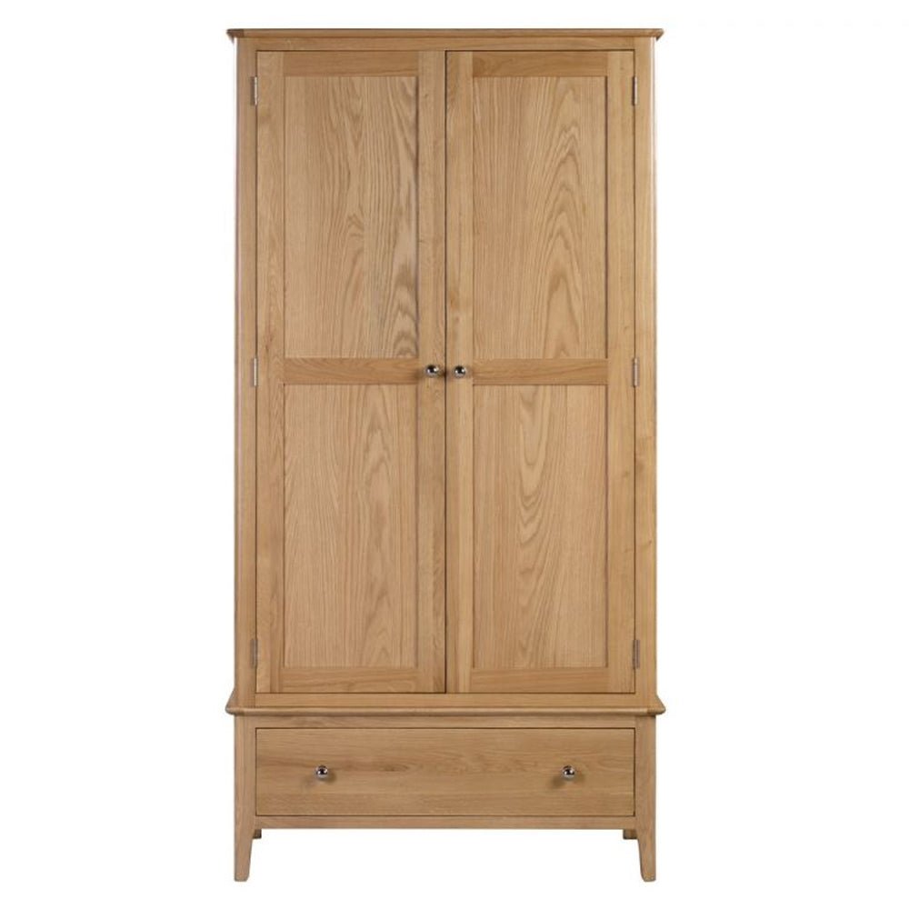 Natural oak two door wardrobe with base drawer, featuring paneled doors and metal knobs.