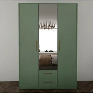 The CHOICEWARDROBE 135cm Hinged Door Mirrored Wardrobe in matt green features three doors, a mirrored center, gold handles, and two double drawers—stylish storage perfect for bedrooms with white walls and wooden floors.