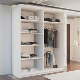The CHOICEWARDROBE 150cm Sliding Door Mirrored Wardrobe in matt white, featuring a modern panelled design and full-length mirror, provides spacious shelving and two hanging sections for organized clothes in a stylish room with wooden flooring.