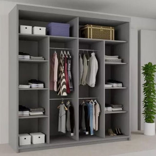 The CHOICEWARDROBE 203cm Sliding Door Mirrored Wardrobe in matt grey with wave-design panels has shelves and hanging space for clothes, boxes, and bags. Shirts, dresses, and jackets hang neatly. A green potted plant is nearby.