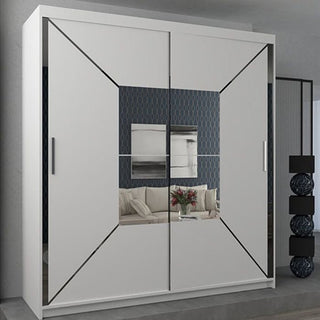 The CHOICEWARDROBE 203cm Sliding Door Mirrored Wardrobe in matt white with a geometric diagonal panel design reflects a couch, flowers, wall art, and the room’s patterned wall in its modern setting.