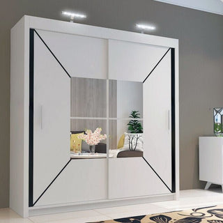 The CHOICEWARDROBE 203cm Sliding Door Mirrored Wardrobe features a matt white finish, geometric diagonal panel design, central mirrored panel reflecting bedroom decor, and is illuminated by two overhead lights.