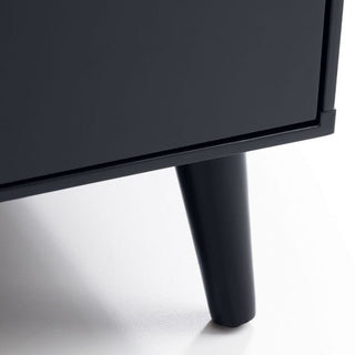 Close-up of the bottom corner of the CHOICEWARDROBE Abrina 80cm Anthracite 2 Door Wardrobe with Drawers, featuring tapered cylindrical legs on a light floor.