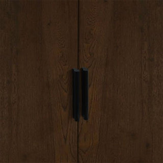 A close-up of the CHOICEWARDROBE Akron 2 Door Wooden Wardrobe in walnut and black finish shows sleek black vertical handles and visible wood grain, combining modern industrial style with practical bedroom storage.