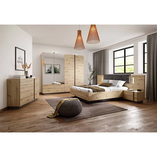 Modern bedroom with light wood furniture, featuring the CHOICEWARDROBE Alaro 4 Door Mirrored Wooden Wardrobe in oak finish, a bed, nightstands, and dresser. Large windows with gray curtains and pendant lights accent the wooden floor and brown rug.