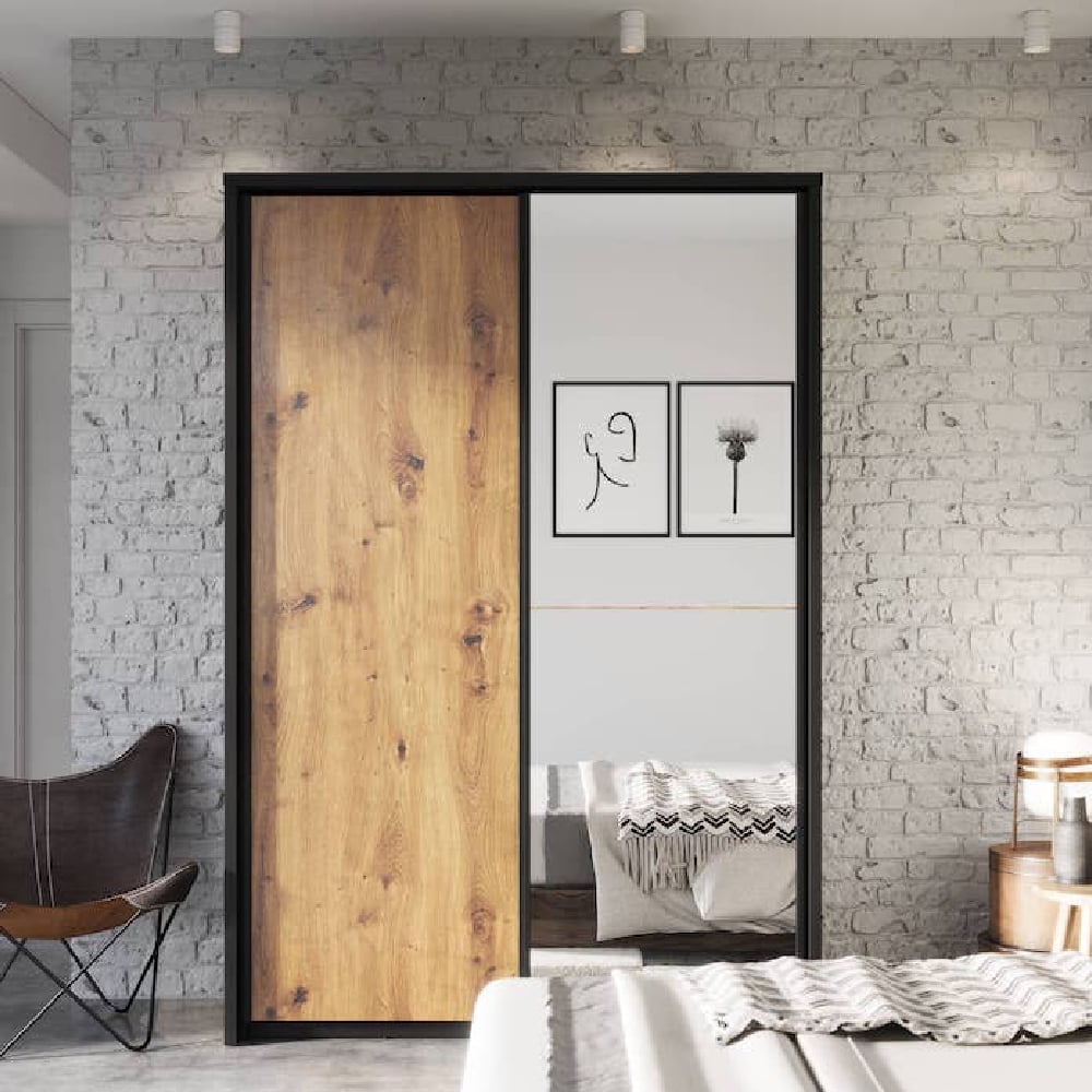 ChoiceWardrobe Allen 160cm sliding door wardrobe with wood effect and mirror door against brick wall.