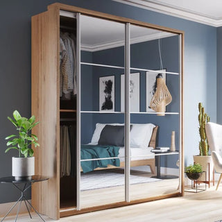 The CHOICEWARDROBE Allen 180cm Shetland Oak & Mirror Sliding Door Wardrobe offers modern, space-saving storage with shelves and hanging rails, reflecting a stylish bedroom with a made bed and contemporary decor.