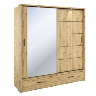 Artisan oak sliding wardrobe with full-length mirror and warm LED lighting — adds elegant depth and ambience to modern bedrooms.