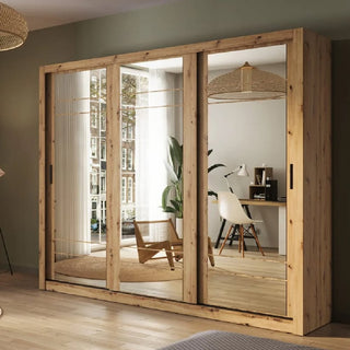 The CHOICEWARDROBE Allen 3 Door Sliding Mirrored Wardrobe (250 cm) in artisan oak finish features a modern rustic design with black handles, shelves, hanging rails, and mirrored doors for a stylish, spacious look.