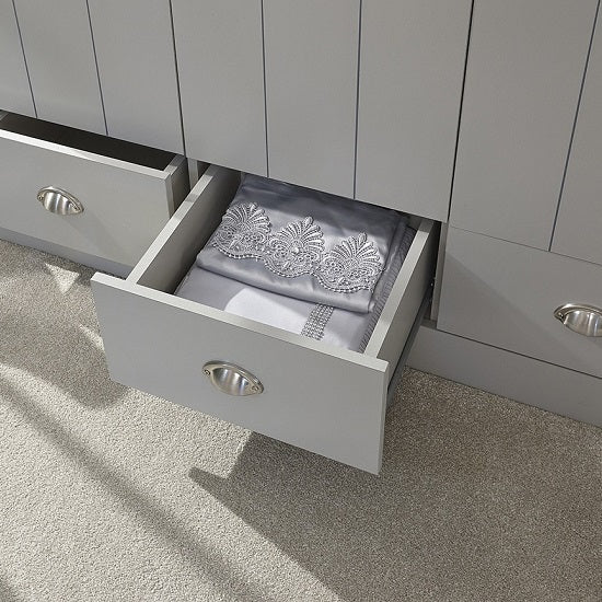 Grey Alverton wardrobe drawer with brushed steel handle, partially open