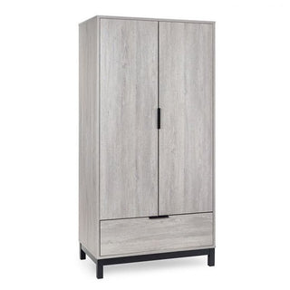 The CHOICEWARDROBE Baara 2 Door Wardrobe in light grey ash effect features black metal legs, a lower drawer, and modern black handles, offering practical bedroom storage with a sleek industrial design. Shown against a plain white background.