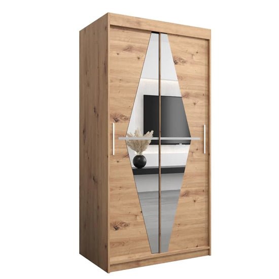 Oak sliding wardrobe with diamond-mirror doors, silver handles, and visible interior shelving.