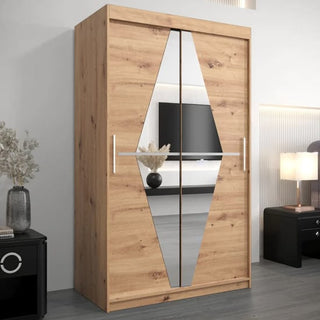 A modern bedroom includes the CHOICEWARDROBE Beloit 120cm Artisan Oak Mirrored Wardrobe with 2 sliding doors, a diamond-cut mirror, sleek metal handles, and spacious shelving, complemented by a lamp, TV, and decor.