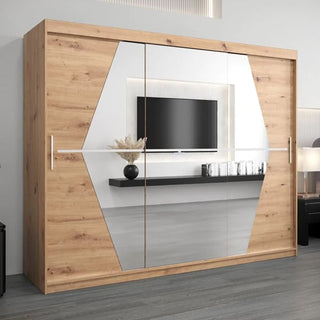 The CHOICEWARDROBE Beloit Mirrored Wardrobe 250cm in artisan oak features 3 sliding doors, a panoramic mirror, and a full interior storage system. Positioned by a light wall, it reflects the room’s TV, shelf, and decor beautifully.