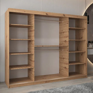 The CHOICEWARDROBE Beloit Mirrored Wardrobe 250cm in artisan oak finish, featuring 3 sliding doors with a panoramic mirror and a full interior storage system, is placed against a light-colored wall with vertical lines and a round mirror to the right.