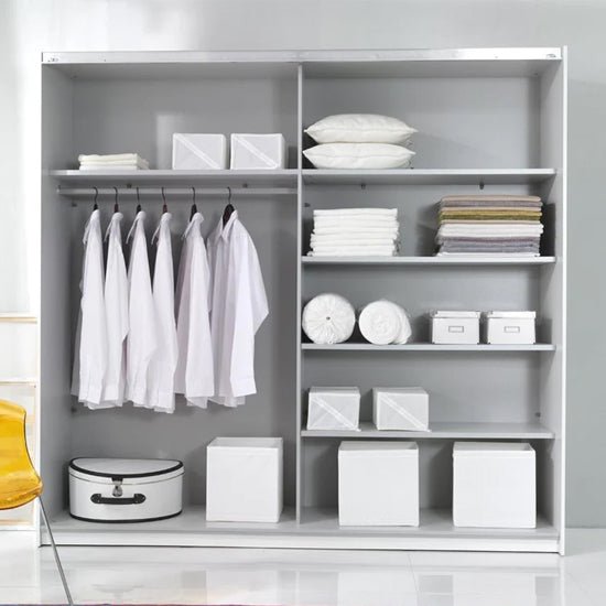 CHOICEWARDROBE Biella 180cm wardrobe in black finish with shelves, hanging shirts, towels, and storage boxes. Yellow chair visible.
