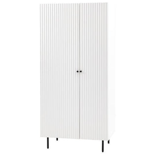 The CHOICEWARDROBE Bienne White Fluted Wooden Wardrobe features two doors with vertical grooves, drawers, small round handles, and black metal legs—offering modern designer storage for any room.