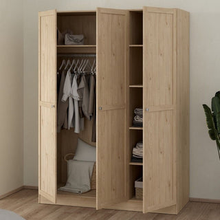 The CHOICEWARDROBE Burbank 147cm 3 Door Wooden Wardrobe in hickory oak finish stands open, displaying clothes on the hanging rail, folded towels and storage baskets on shelves, plus extra items at the bottom and a green plant nearby.
