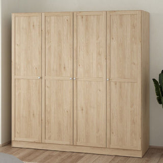 The CHOICEWARDROBE Burbank 195cm 4 Door Wooden Wardrobe in a Hickory Oak finish stands against a plain wall on a wooden floor, featuring simple panelled doors with small round handles; a green plant is partially visible on the right.