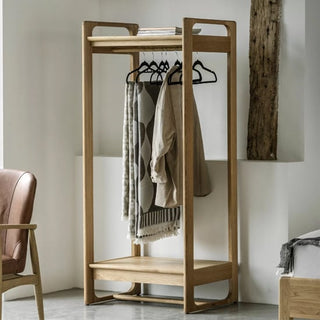 ChoiceWardrobe Cairo Natural Wooden Open Wardrobe with clothes rail and shelf shown in a modern minimalist bedroom interior