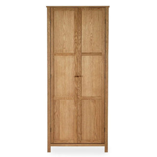 The CHOICEWARDROBE Calliope 80cm 2 Door Solid Wooden Wardrobe features a natural oak finish, hanging rail, and shelf. With a minimalist design, straight edges, and paneled doors, it stands on four legs for stylish bedroom storage.